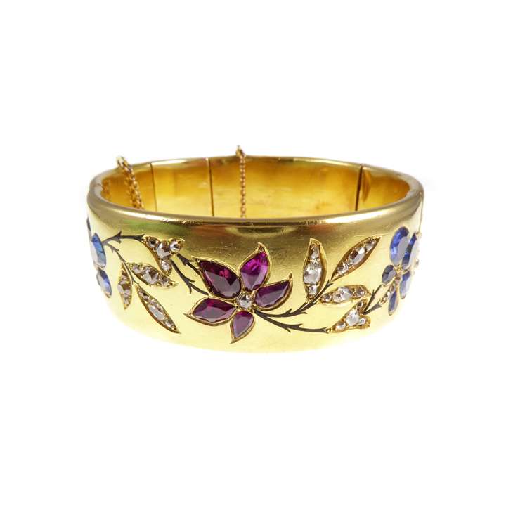 19th century gold, ruby, sapphire and diamond hinged bangle, with presentation inscription to the artist Marie-Louise Roosevelt Pierrepont, Countess Manvers (1889-1984)